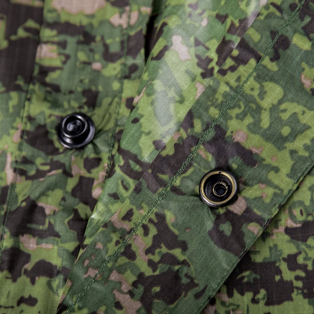 Close-up of the durable snap buttons on the side of the custom Philippine jungle camo military poncho.
