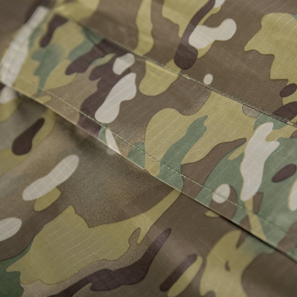 Close-up of the adjustable waist belt and buckle on the custom CP camo waterproof long raincoat.