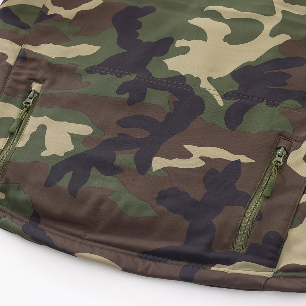 Detail of the durable, water-resistant polyester softshell fabric in classic M81 woodland camouflage.