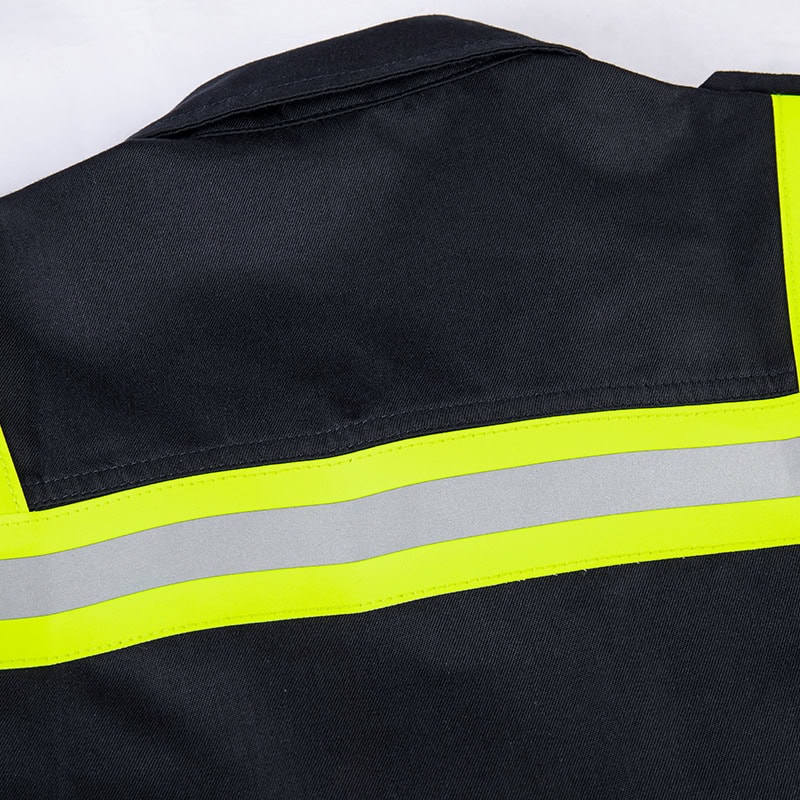 Close-up of the high-visibility fluorescent and silver reflective stripe on the custom flame resistant firefighter uniform.