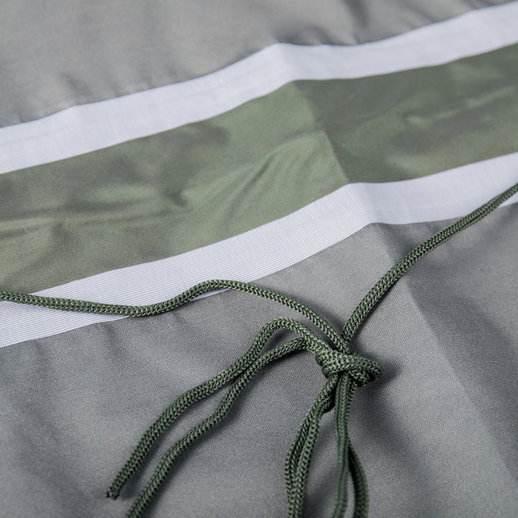 Close-up of the adjustable waist drawstring on the custom olive green military rain poncho.