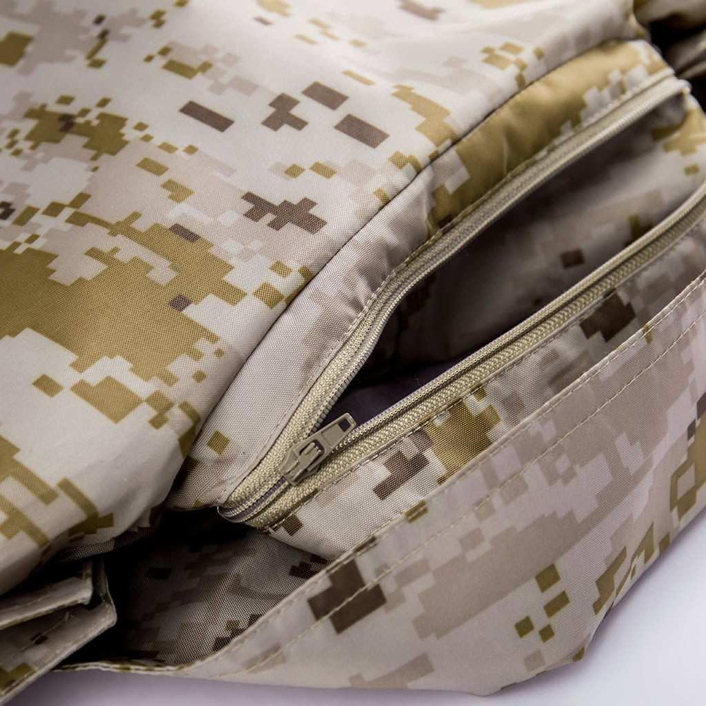 Close-up of a zippered inner pocket on the custom digital desert military raincoat.