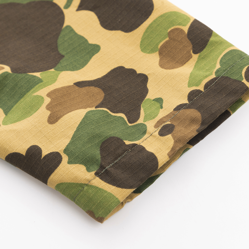 Close-up of the reinforced cuff with wrapped edges on the custom duck hunter camo field jacket.
