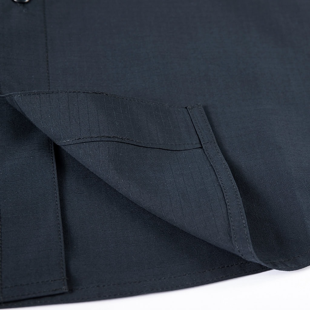 Close-up of a deep slant pocket on the custom navy blue waterproof work trousers.