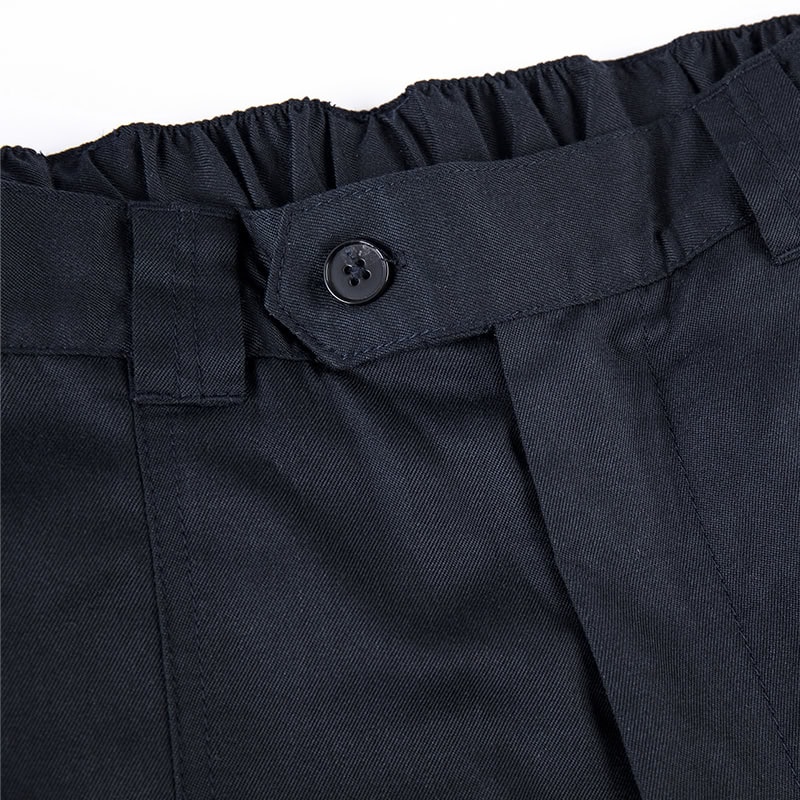Close-up of the elasticated waistband and button closure on the custom flame resistant firefighter uniform trousers.