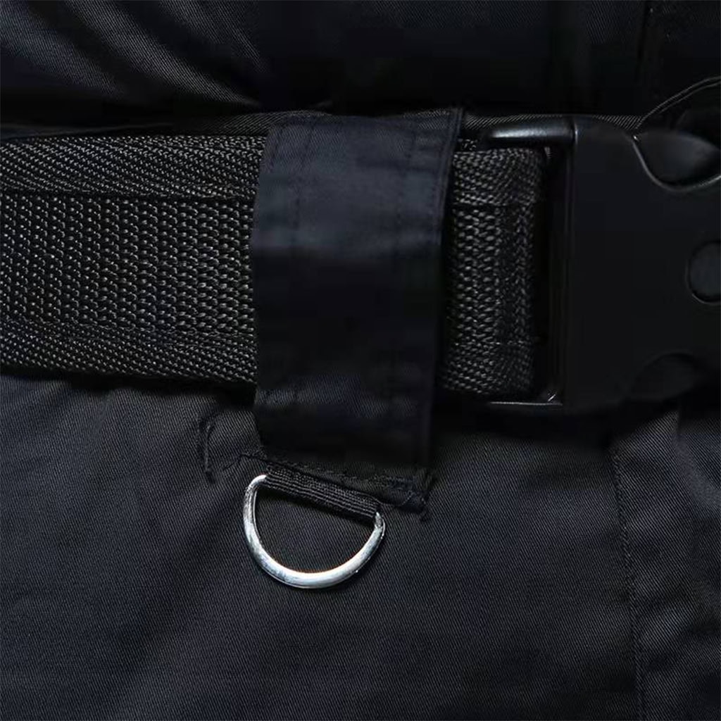 Close-up of the wide belt loop and D-ring on the waistband of the custom black security guard uniform trousers.