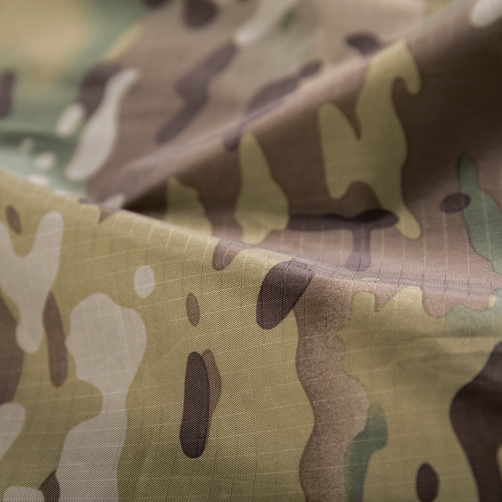Close-up of the waterproof, PU/PVC-coated 100% Polyester fabric in CP camouflage.