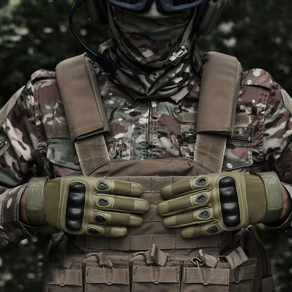 Hard knuckle tactical gloves worn with tactical vest field use
