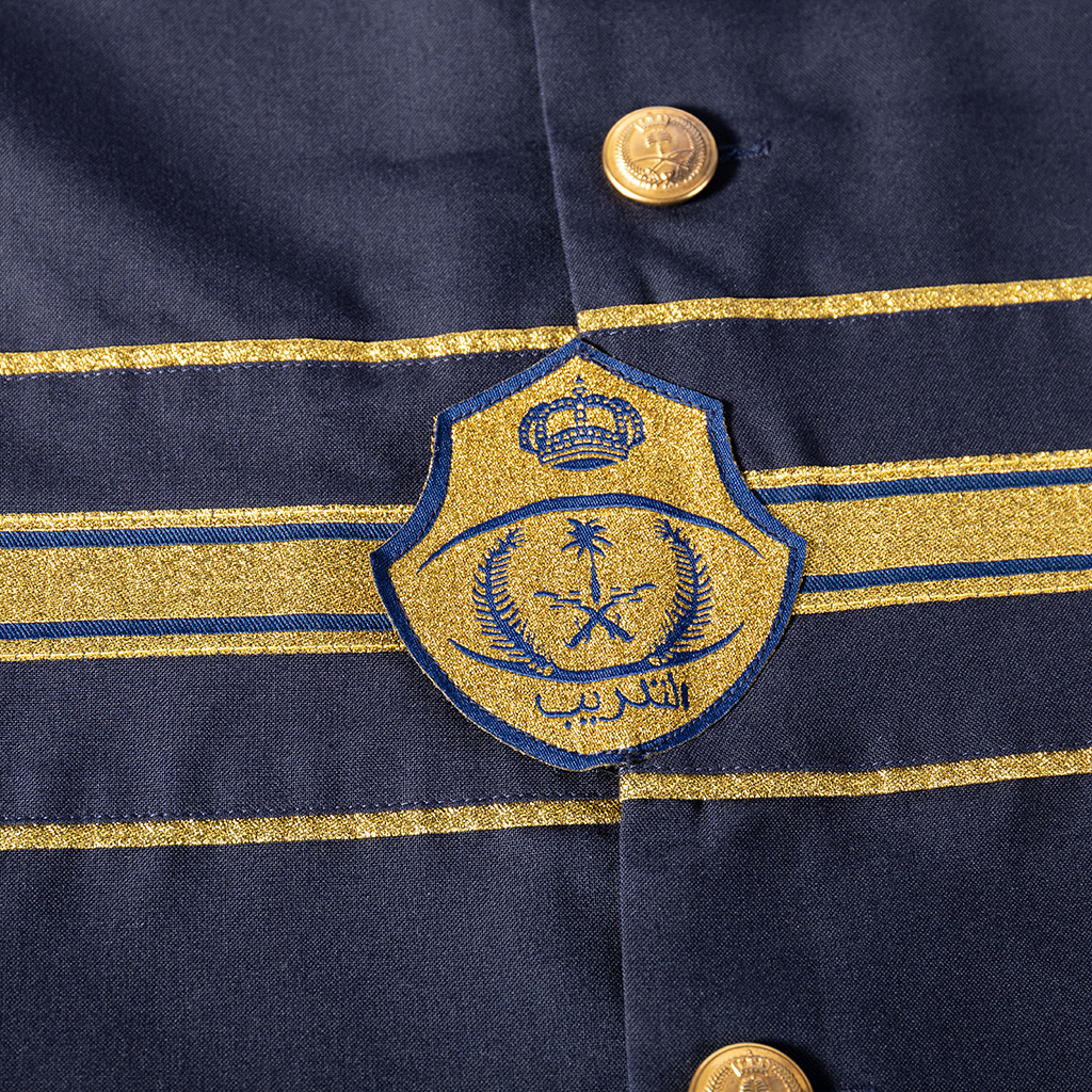 Custom ceremonial uniform embroidered badge and gold waist trim detail